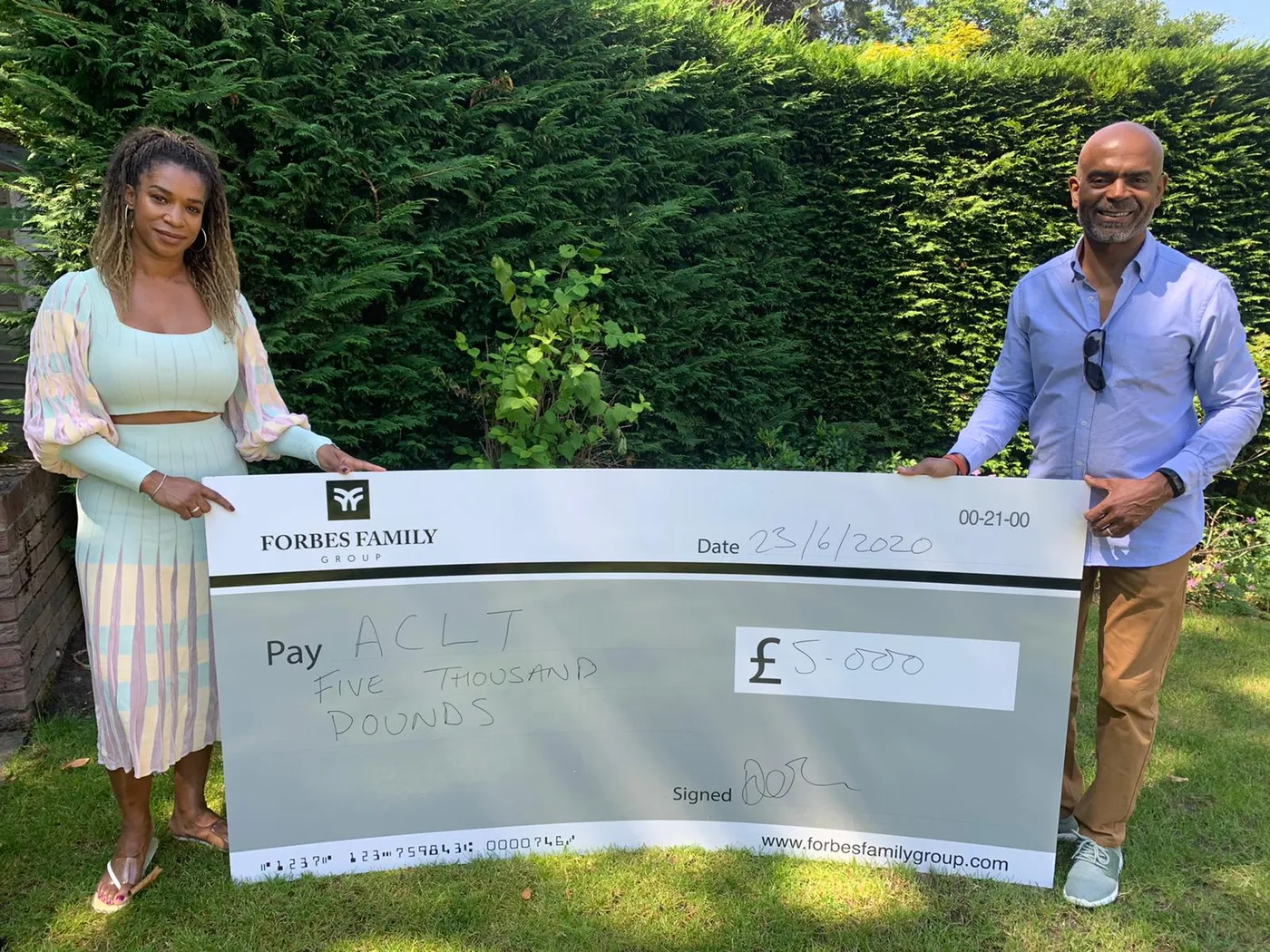 Socially-distanced giant cheque presentation for Forbes Family Group