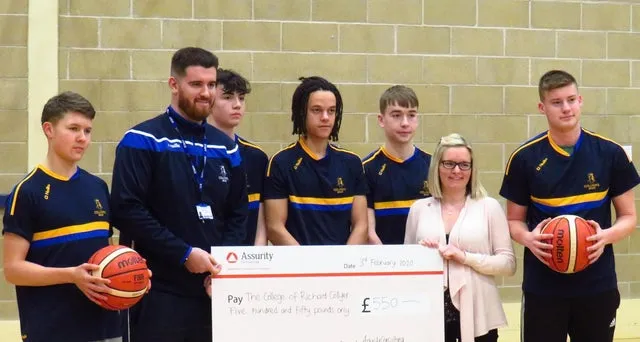 Giant charity cheque presentation for Assurity Consulting