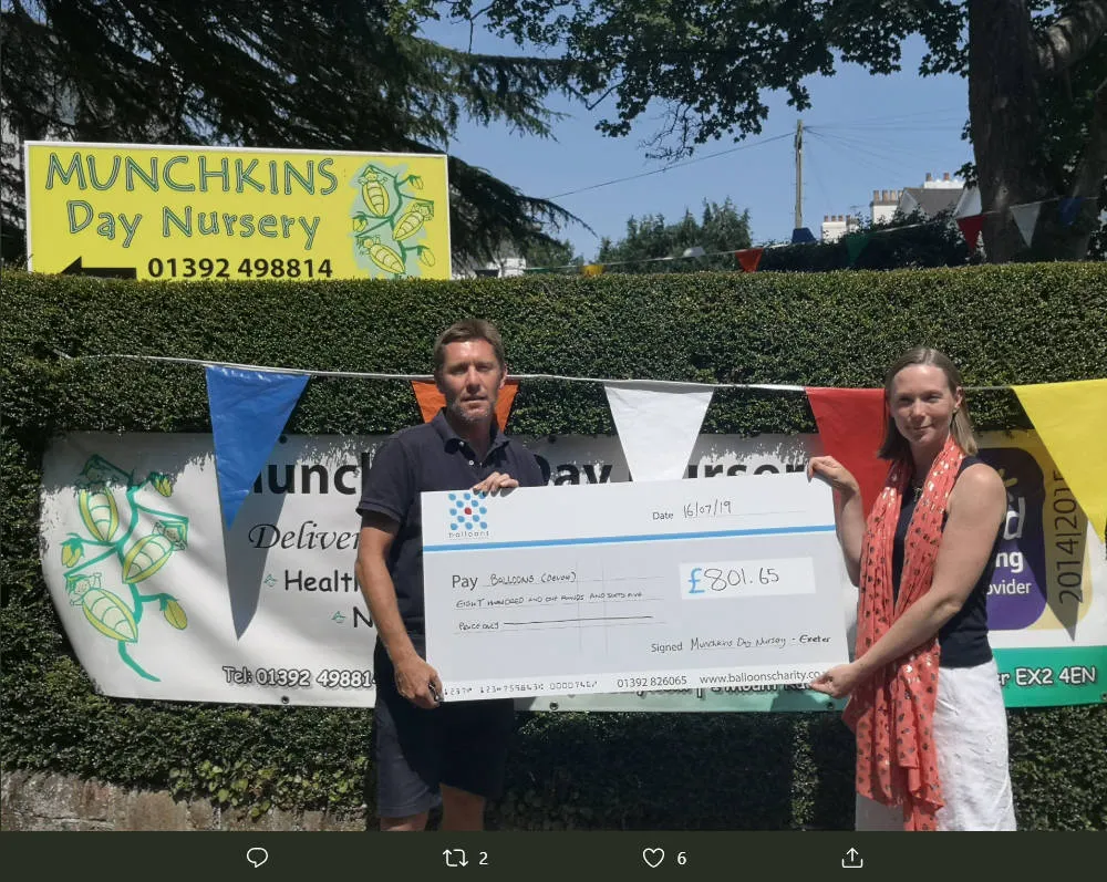 Giant cheque presentation for Balloons Charity at Munchkins Day Nursery