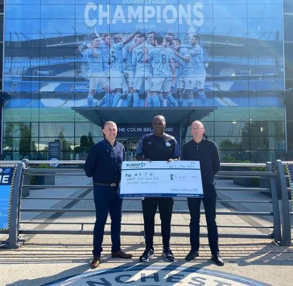 Giant charity cheque for Man City in the Community / Blindspot Global