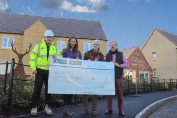 Giant cheque for the Cameron Homes Warwickshire flooding appeal