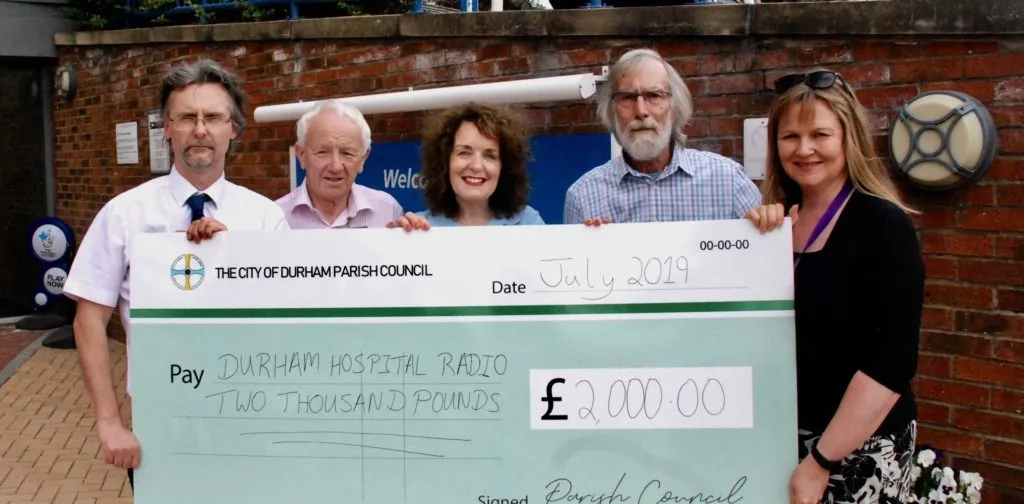 Giant cheque for City of Durham Parish Council and Durham Hospital Radio