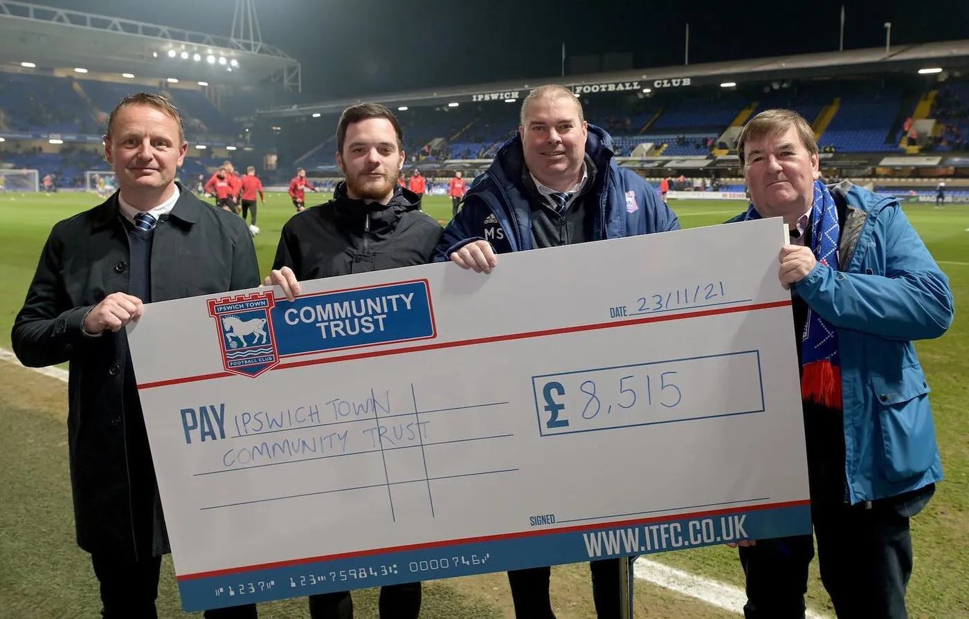 Giant presentation cheque ready for a charity handover