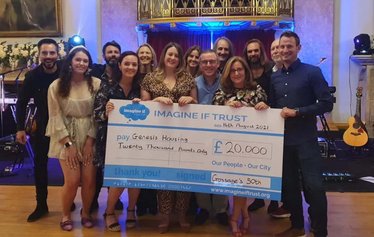 Giant fundraising cheque presented at a community event