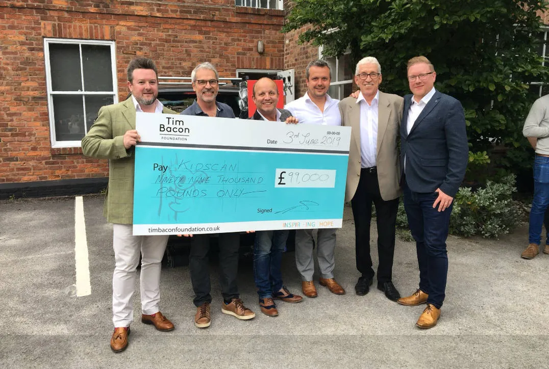 Giant cheque presentation for the Tim Bacon Foundation